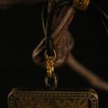 The Black Jambhala Amulet: Hand-Painted Tibetan God of Wealth Pendant (Silver-Clad Copper) - Image 3