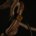 The Black Jambhala Amulet: Hand-Painted Tibetan God of Wealth Pendant (Silver-Clad Copper) - Image 5