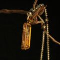 The "Sovereign of Wealth": Yellow Jambhala Thangka Locket | Ultimate Prosperity (Red Lotus Edition) - Image 4